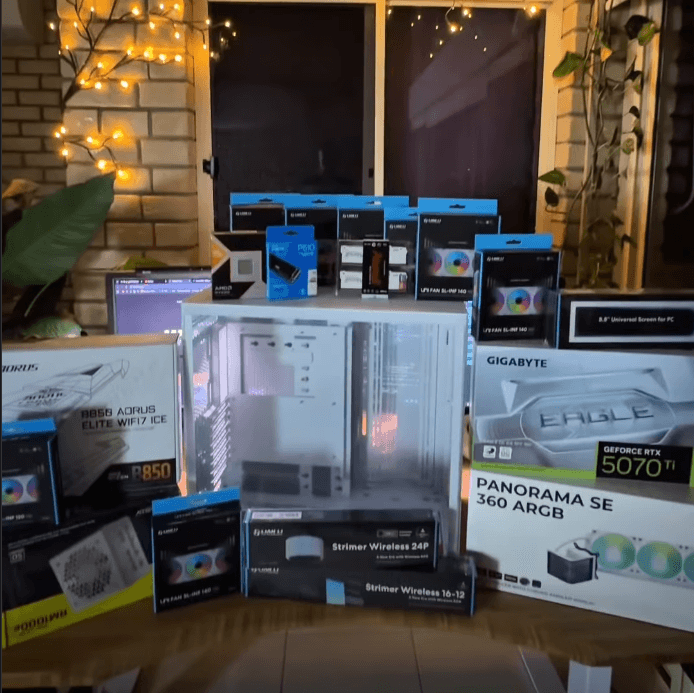 Modern computer desk setup with peripherals, lighting, and workspace layout building of custom PC by Jakub Varinsky